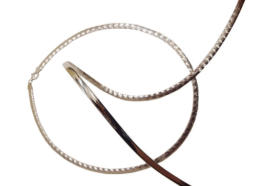 9k WG Italian Double Sided Plain and Swiss Cut Omega Chain 5mm wide 50cm  Approx 23.4g  This is an evening piece not suitable for everyday wear. To prevent damage, chain should be stored flat in a protective box.