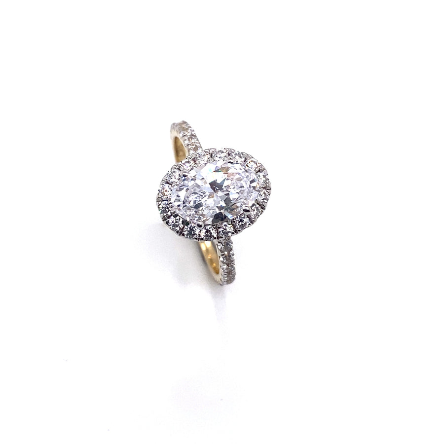 "Alannah" 9k YG 9 x 6mm (1.20ct)  CZ Oval Halo Ring with CZ Halo. CZ stones set on band. Size L