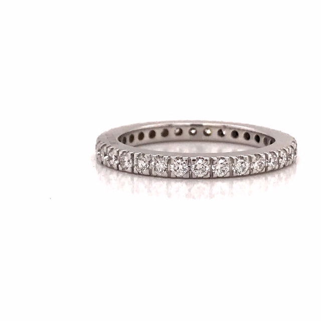 18ct White Gold Ladies Claw set Wedding band... Set with 32 brilliant cut diamonds =0.70pt ..Diamonds set completely around band...Color:  G..Clarity:  VS..Size M