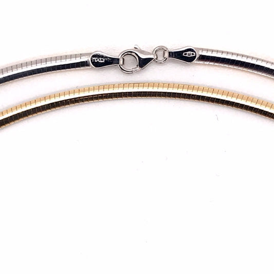9k YG Italian Double Sided Plain with WG Rhodium Plating on one side  3mm Omega Chain 50cm  Approx 13.8g. This is an evening piece not suitable for everyday wear. To prevent damage, chain should be stored flat in a protective box.