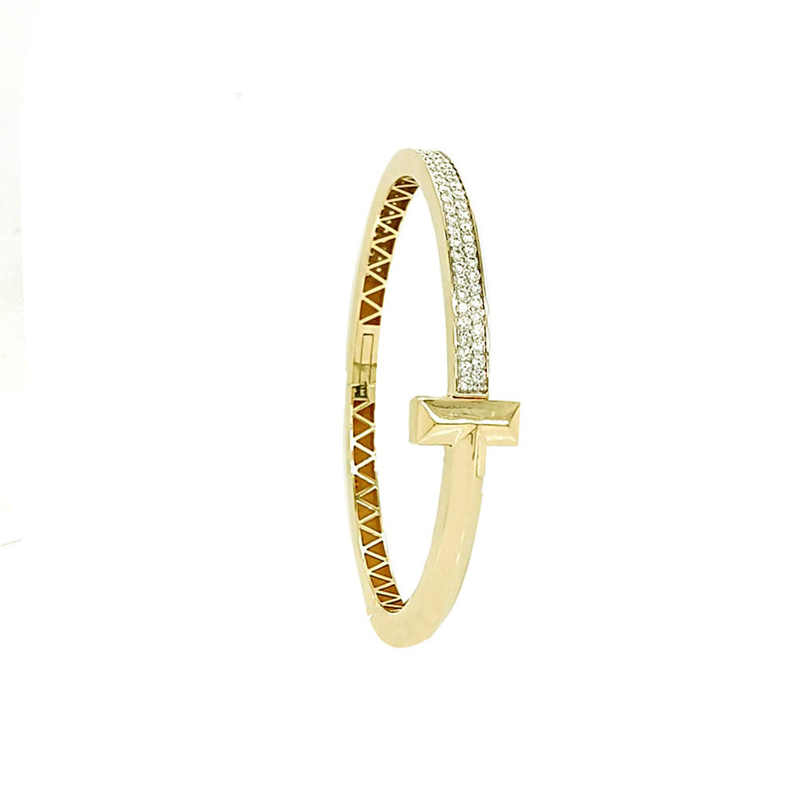 9k YG Hinged Oval Bangle with Diamonds and T-Clasp, 85D = approx.1.43ct, SI1 G.  57x49mm