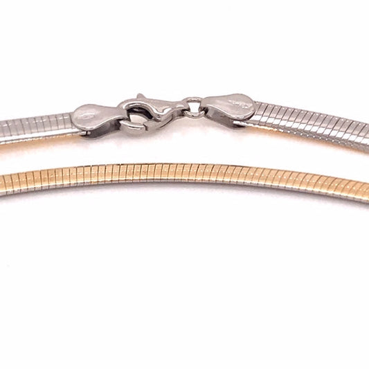 9k YG Italian Double Sided Plain with WG Rhodium Plating on one side  5mm Omega Chain 50cm  Approx 22.0g This is an evening piece not suitable for everyday wear. To prevent damage, chain should be stored flat in a protective box.